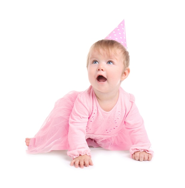 Cute baby girl in party cap on white background