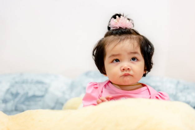 Cute baby girl in a pink dress