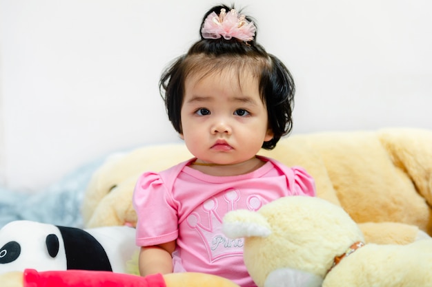 Cute baby girl in a pink dress