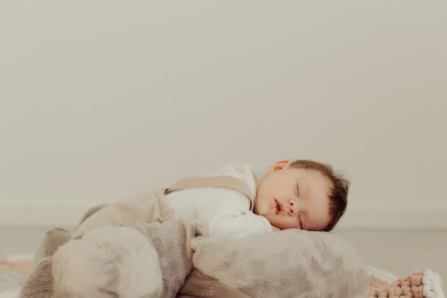 cute baby girl sleeping on bed at home