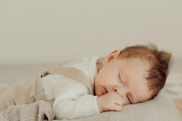 cute baby girl sleeping on bed at home