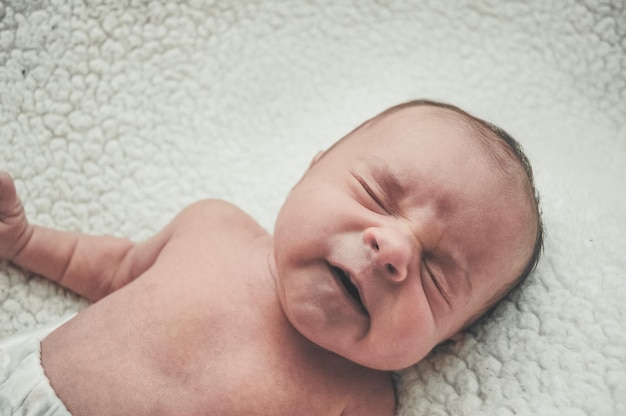 cute baby girl sleeping on bed