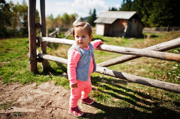 Cute baby girll waliking in mountains. Little discoverer.