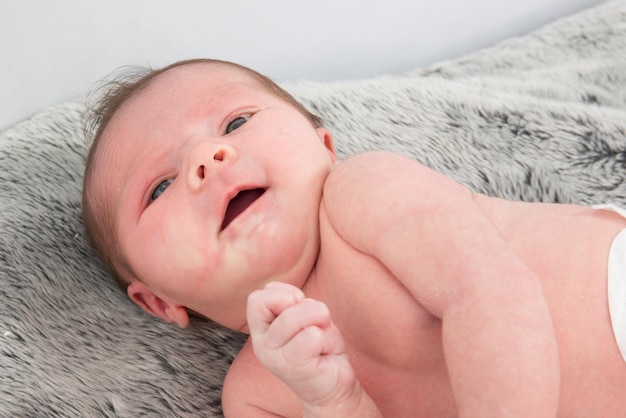 A cute baby  looking at the camera studio shot