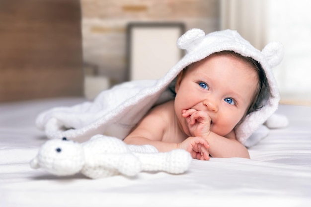 cute baby lying on bed