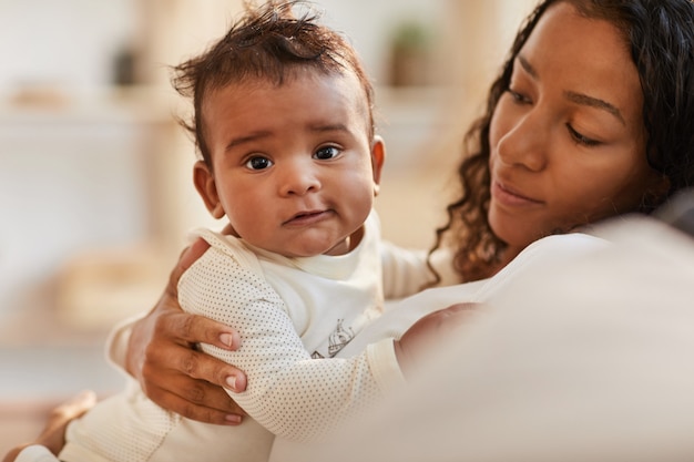 Cute Baby in Mothers Arms