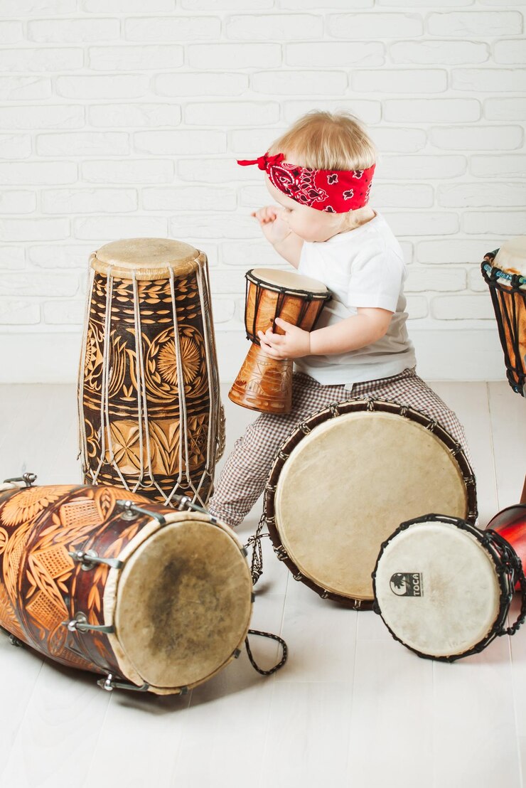 Cute baby playing drums