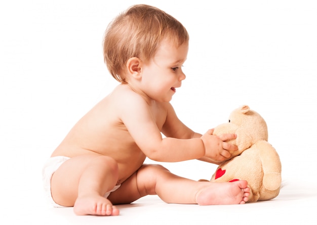 Cute baby playing with toy.