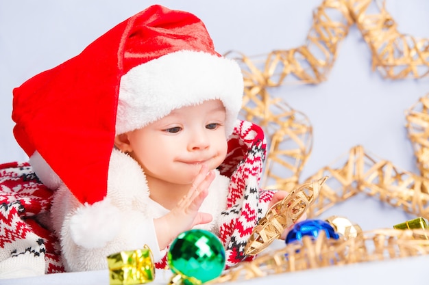 Cute baby in red santa hat