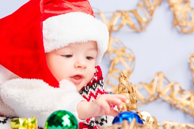 Cute baby in red santa hat