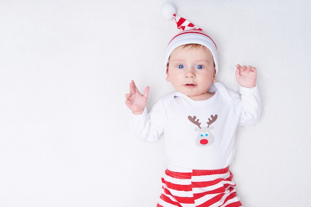 Cute baby in Santa costume with white background