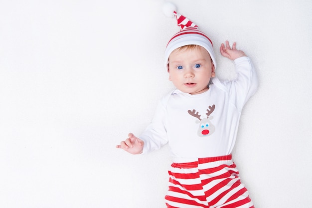 Cute baby in Santa costume with white background