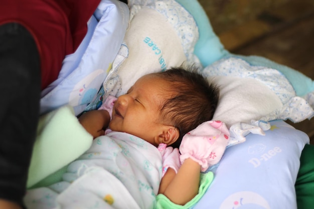 Cute baby sleeping on bed