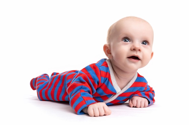 Cute baby in a striped bodysuit on a white isolated background looks up