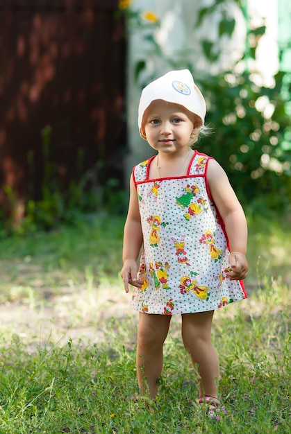 Cute baby woman in park.