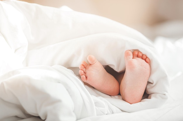 Cute babys tiny feet Infants fingers Closeup picture of childs feet