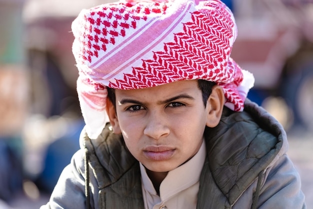 Cute Bedouin boy portrait wearing traditional turban, South Sinai, Egypt