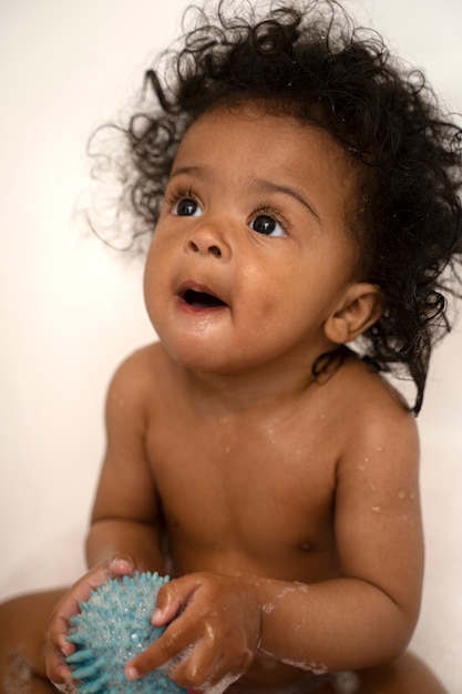 Photo cute black baby at home