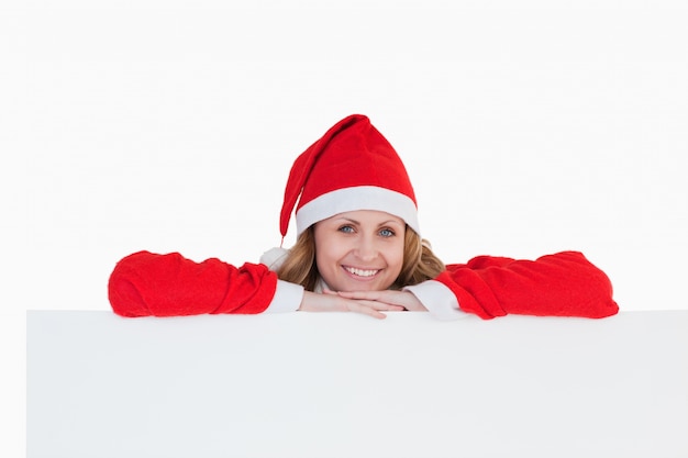 Cute blond-haired woman dressed as Santa Claus