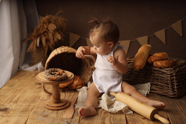 cute blond kid in a chef costume happy baby the kid does not look into the frame