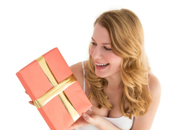 Cute blonde holding a gift