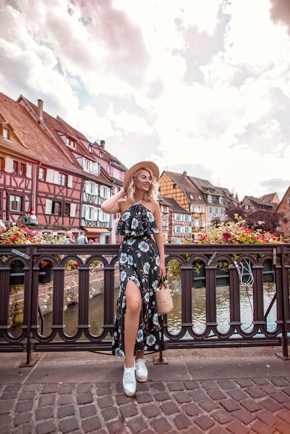 Cute blonde woman exploring european city, colmar, france