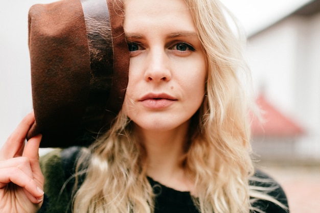 Cute blonde woman with hat