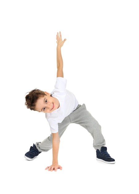 Photo cute boy dancing on white background