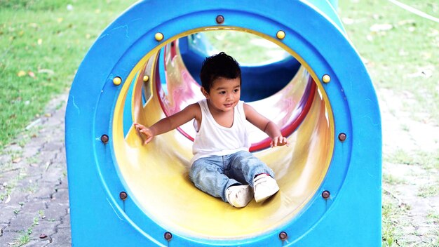 Cute boy playing in playground