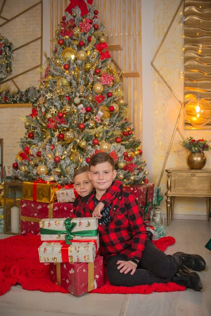 cute boys together at christmas with gifts