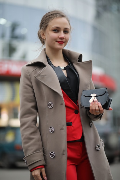 Cute businesswoman goes to a business meeting in a cafe