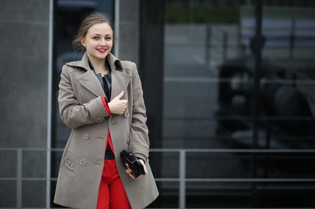 Cute businesswoman goes to a business meeting in a cafe