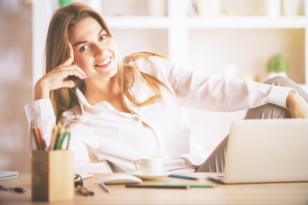 Cute businesswoman at workplace