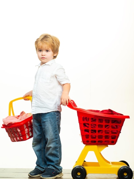 Cute buyer customer client hold shopping cart kids store boy child shopping big purchase kid hold pl