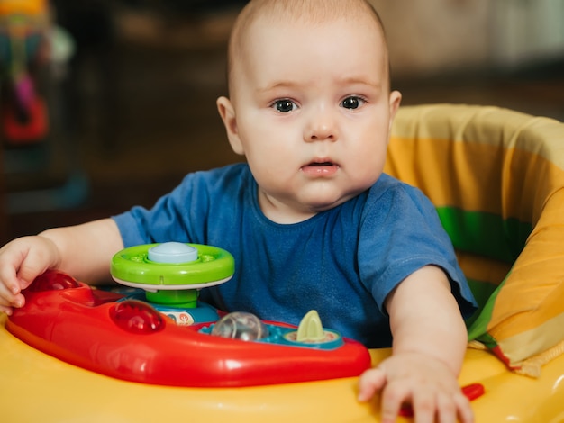 Cute Caucasian boy infant baby in Walker