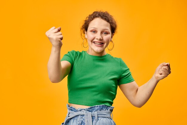 Cute cheerful girl in stylish summer clothes posing person