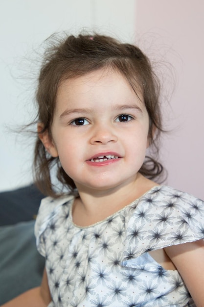 Cute cheerful little girl portrait qt home bedroom