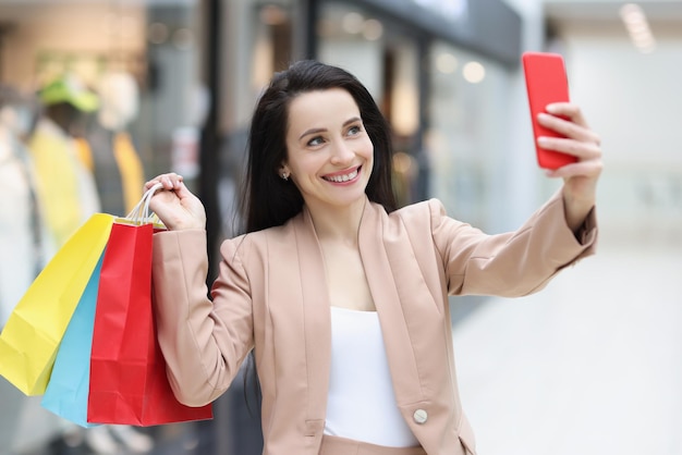 Cute cheerful woman making photo