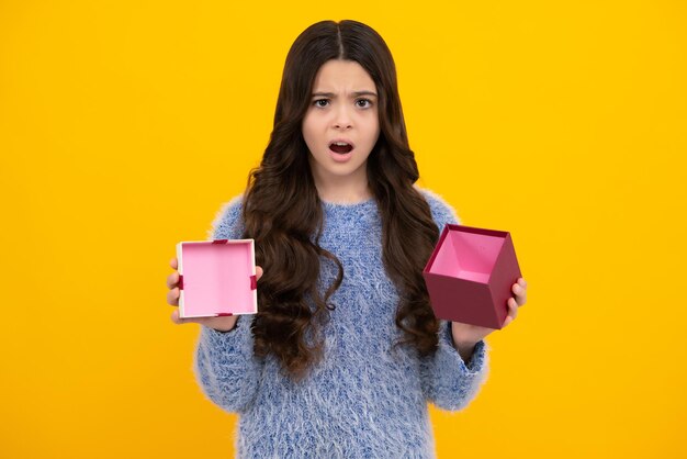 Cute child girl congratulate with valentines day giving romantic gift box present greeting and gifting concept unhappy sad teenager girl