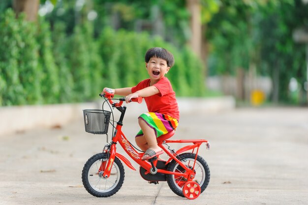 cute child happy with bicycle