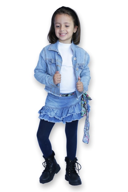 Photo cute child in jeans doing photoshoot against white background