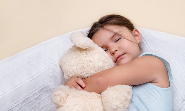 Cute child sleeping with a toy