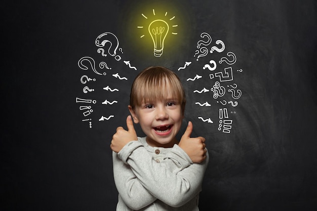 Cute child with light bulb Idea concept