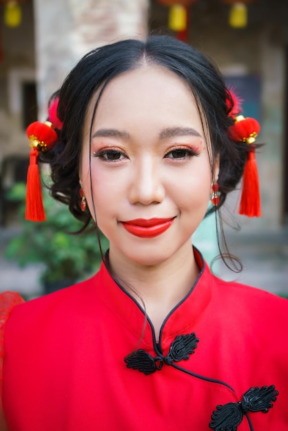 Cute chinese girl in red dress close up