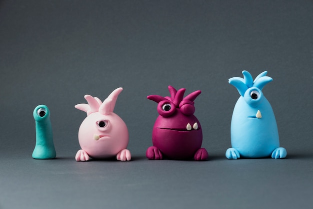 Photo cute colorful play dough monsters