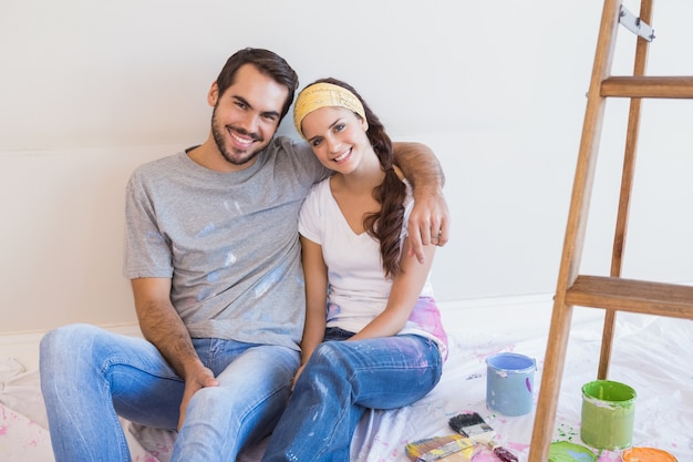 Cute couple about to paint living room