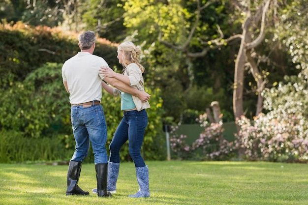 Cute couple dancing in the garden