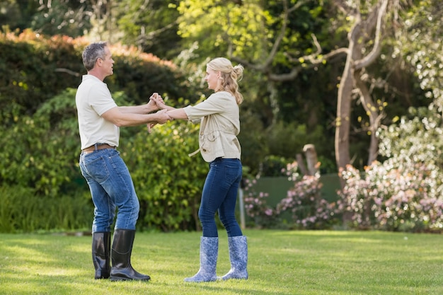 Cute couple dancing in the garden