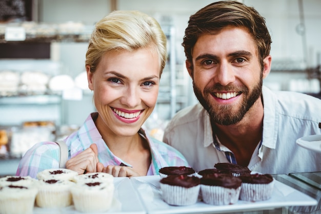 Cute couple on a date looking at the camera 