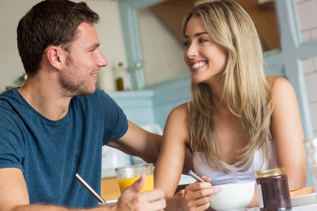 Cute couple having breakfast together